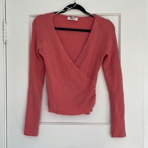 Ribbed, deep v-neck cropped sweater with cinched wrap style waist. Light sweater